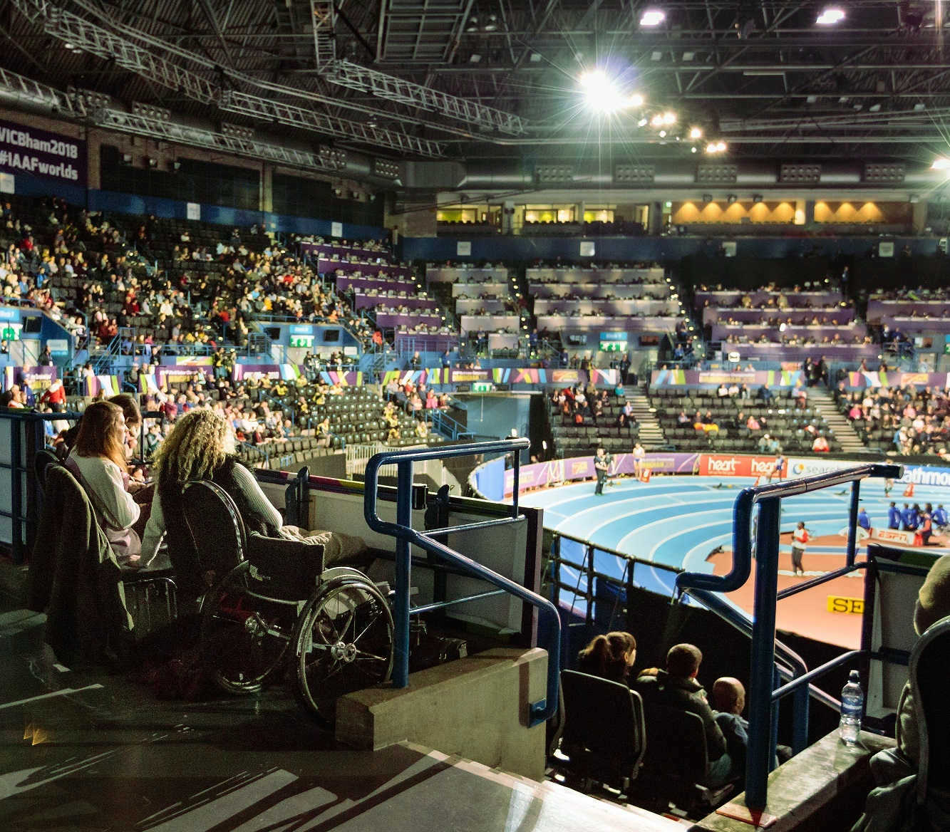 Interior shot of a sports arena with wheelchair accessible seating